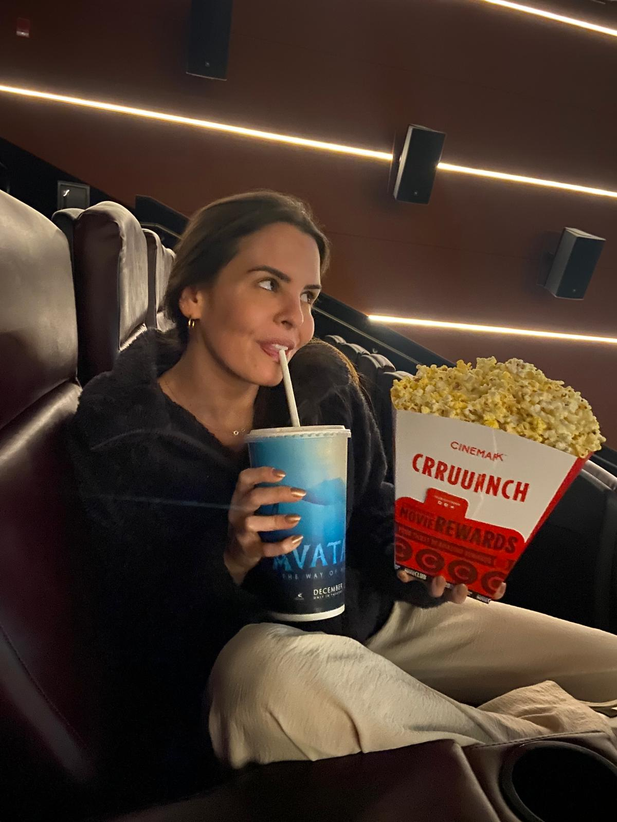 Karen at movie theater with popcorn